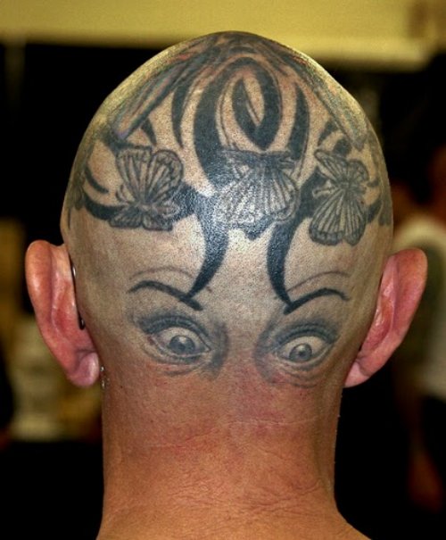 Butterflies And Tribal With Eyes Head Tattoo