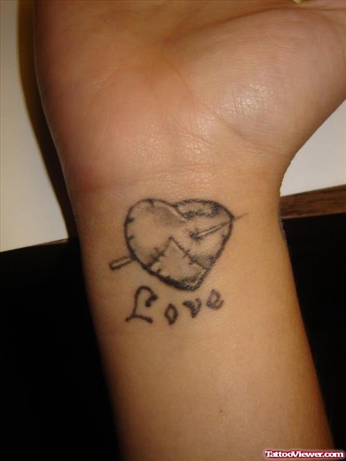 Grey Ink Love Heart Tattoo On Left Wrist