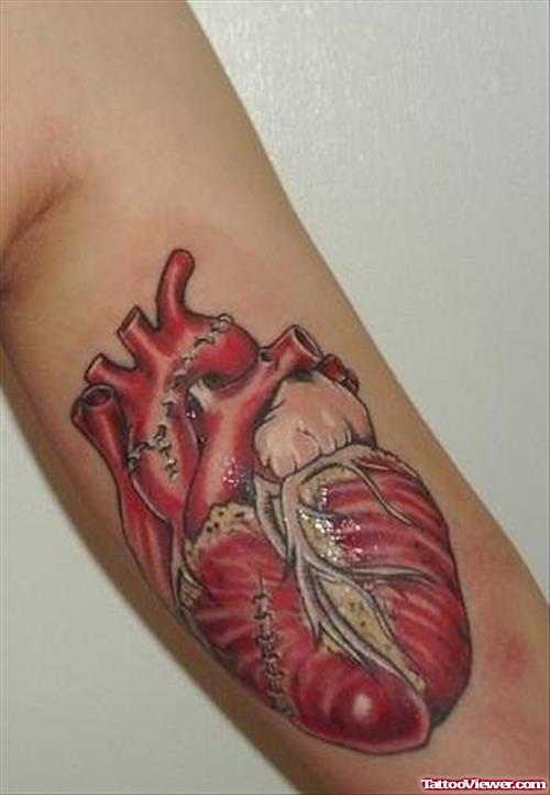 Colored Red Heart Tattoo On Half Sleeve