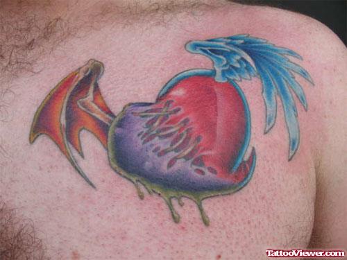 Winged Broken Heart Tattoo On Man Chest