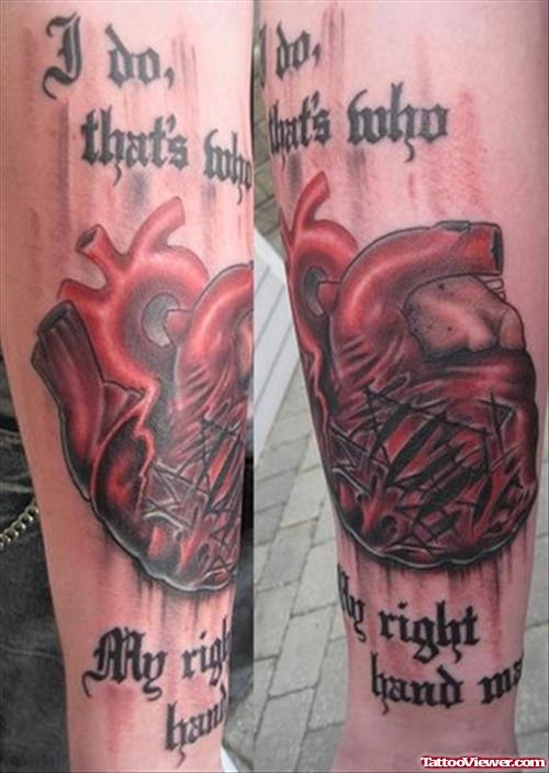 Lettering And Human Heart Tattoo On Sleeve