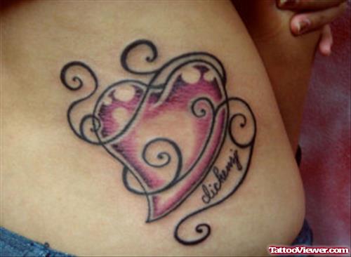 Tribal And Pink Heart Tattoo On Lowerback