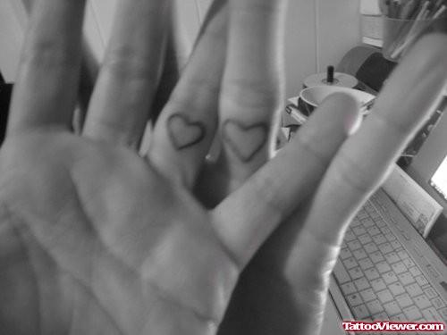 Tiny Heart Tattoos On Fingers