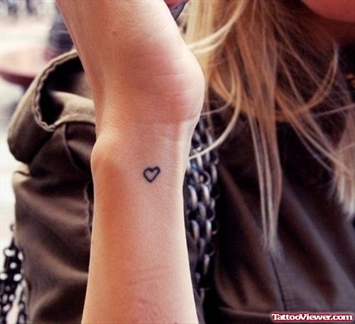 Tiny Heart Tattoo On Girl Wrist