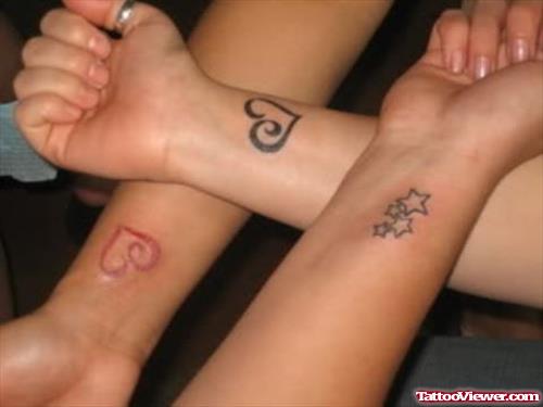 Heart Tattoos On Friends Wrists