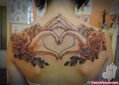 Flowers And Hand Heart Tattoo On Upperback