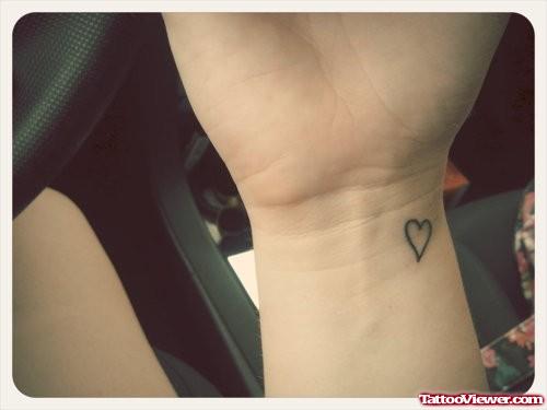 Outline Tiny Heart Tattoo On Wrist