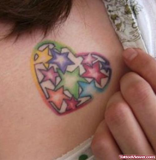Colored Stars Heart Tattoo On Chest