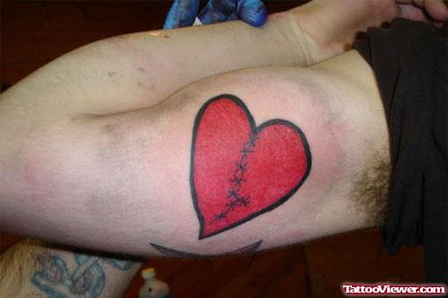 Awesome Red Ink Heart Tattoo On Bicep