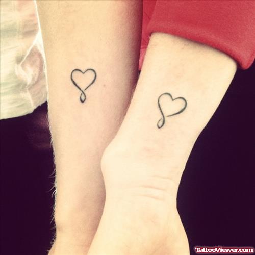 Black Ink Heart Tattoos On Arms