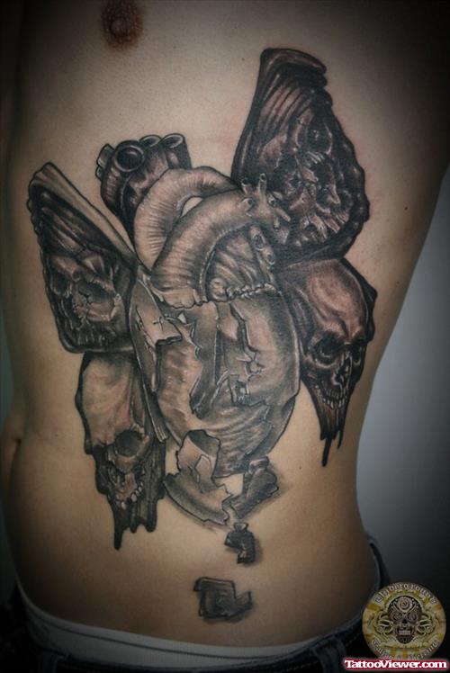 Grey Ink Butterfly Wings Heart Tattoo On Side Rib