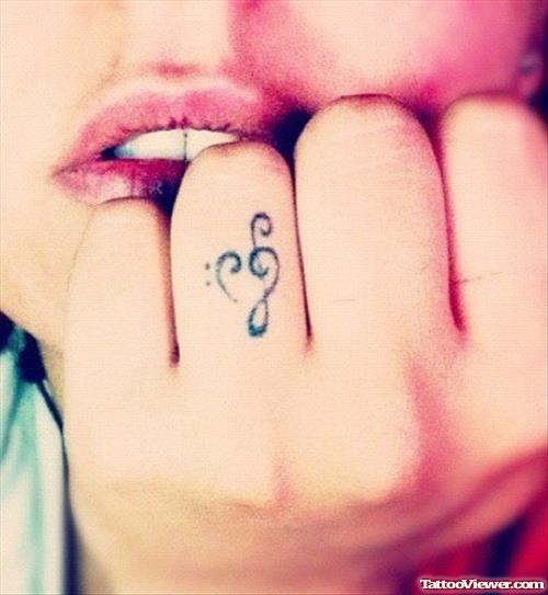 Tiny Music Heart Tattoo On Finger