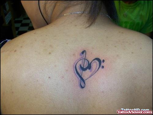 Music Heart Tattoo On Upperback