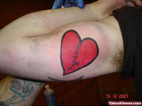 Broken Red Heart Tattoo On Bicep