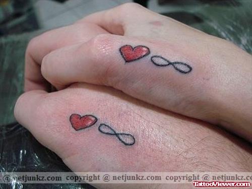 Infinity Symbols And  Heart Tattoo On Hand