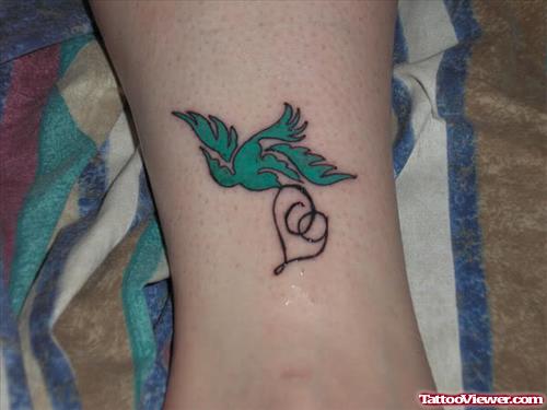 Green Bird and Heart Tattoo on Leg