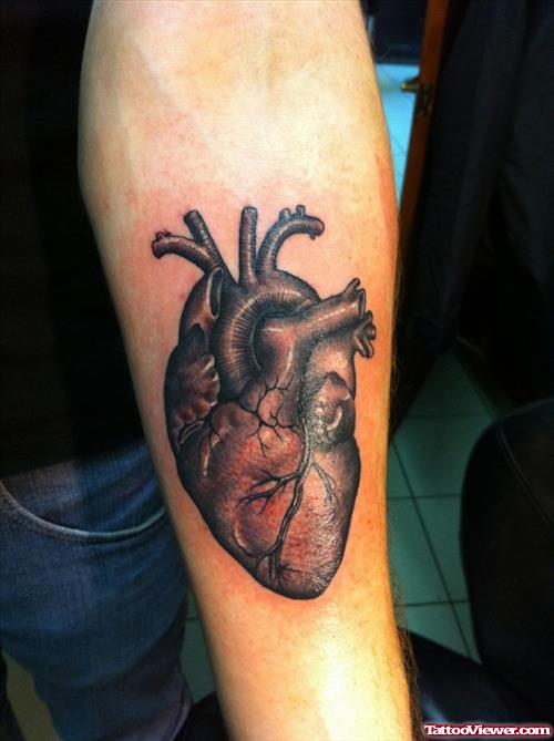Grey Ink Heart Tattoo On Left Arm