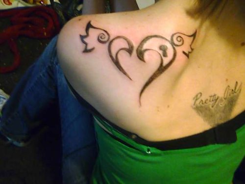 Winged Tribal Heart Tattoo On Back Shoulder