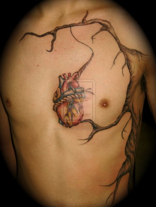 Hanging Human Heart Tattoo On Man Chest