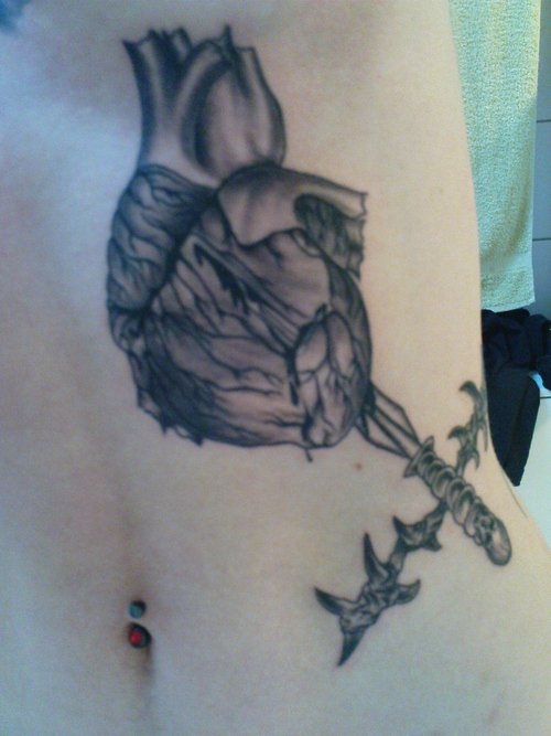 Grey Ink Heart Tattoo On Side Rib