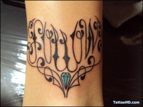 Tribal Heart Tattoo On Arm