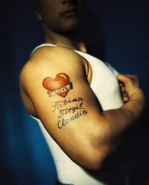 Red Heart Tattoo On Muscles For Boys