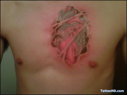 Ripped Skin Colored Heart Tattoo On Man Chest