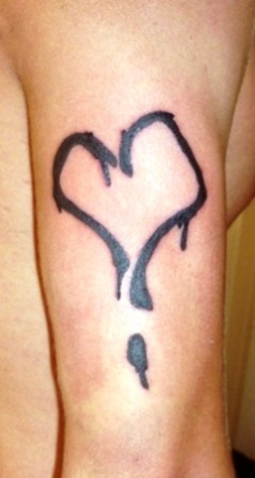 Black Ink Heart Tattoo On Bicep