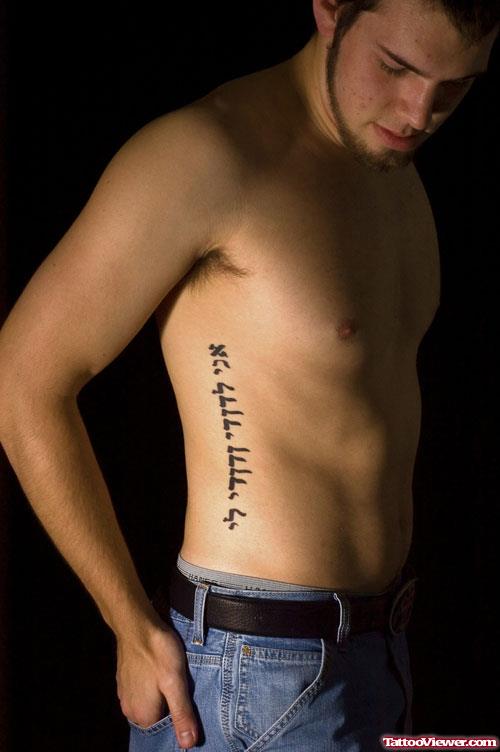 Hebrew Tattoo On Man Side Rib