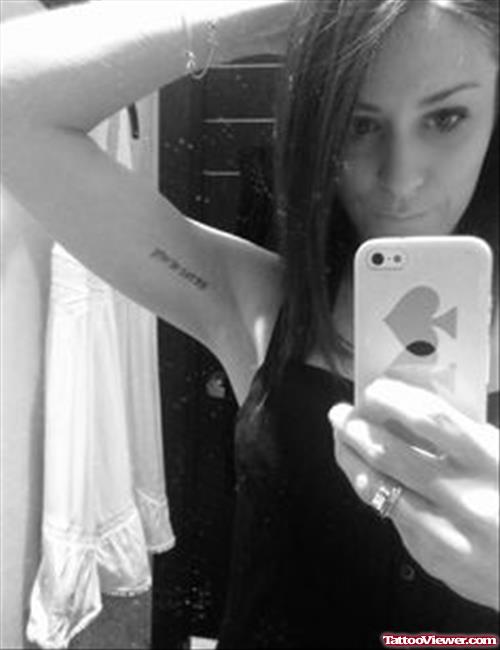 Girl Showing Her Hebrew Tattoo On Inner Bicep