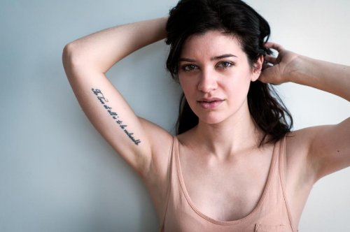 Hebrew Tattoo On Girl Right Inner Bicep
