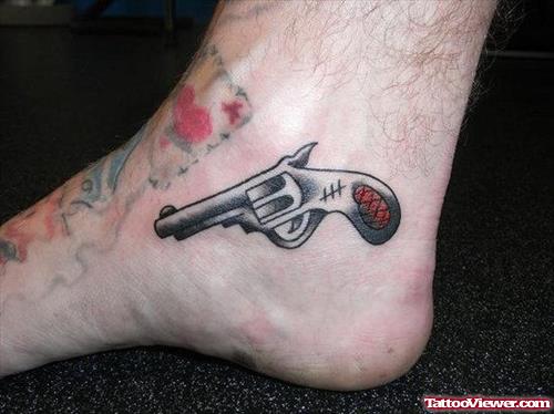 Color Ink Gun Heel Tattoo