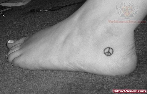 Tiny Peace Symbol Heel Tattoo