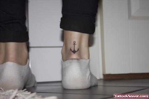 Grey Ink Small Anchor Heel Tattoo