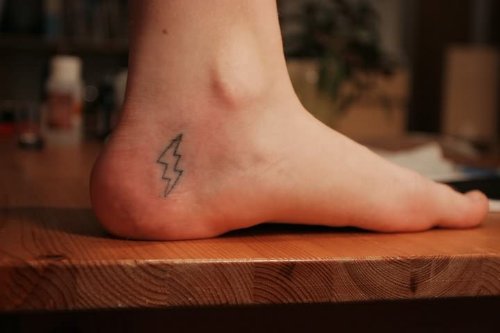 Energy Symbol Tattoo On Heel