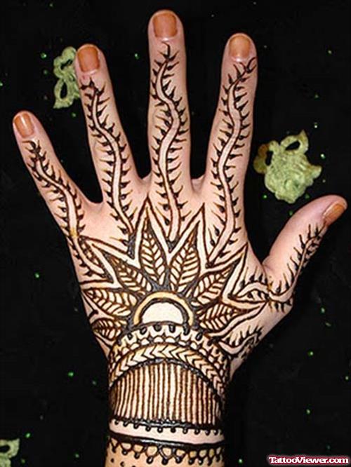 Black Ink Henna Flower Tattoo On Back Hand