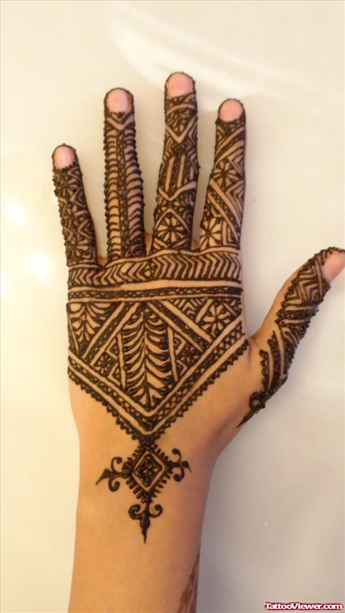Black Ink Henna Tattoo On Left Back Hand