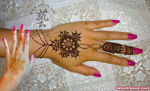 Girl With Henna Tattoo On Back Hand