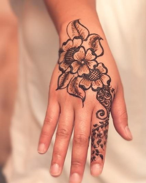 Henna Tattoo On Hand For Young Girls