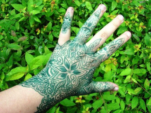 Green Ink Henna Tattoo On Left Back Hand