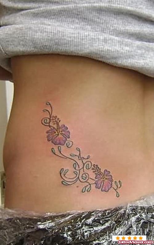 Hibiscus Lower Back Tattoo