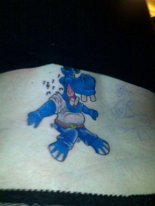 Blue Ink Hippo Tattoo On Back