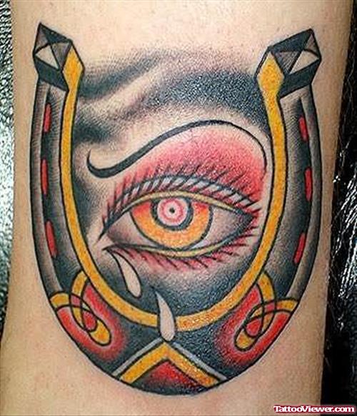 Horseshoe And Big Eye Tattoo