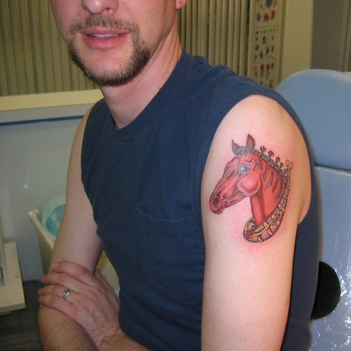 Red Ink Horse Head Tattoo On Left Shoulder