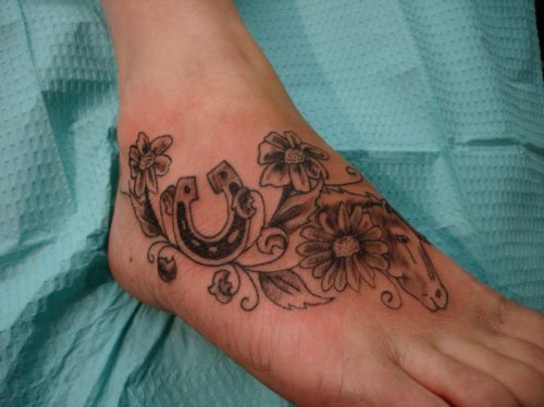 Grey Flowers And Horseshoe Tattoo On Right Foot