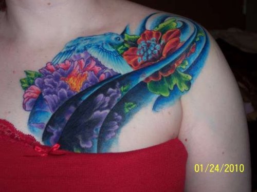 Colored Hummingbird Tattoo On Collarbone