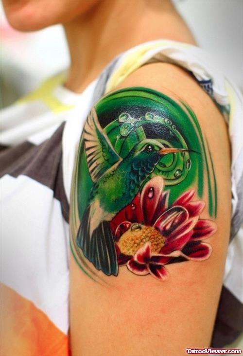 Cute and colourfull hummingbird tattoo on shoulder