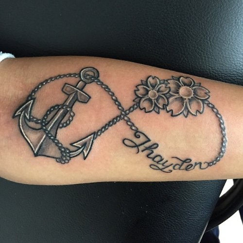 Infinity Anchor With Flowers Tattoo On Forearm