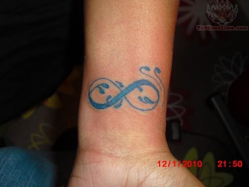 Blue Ink Infinity Tattoo On Left Forearm