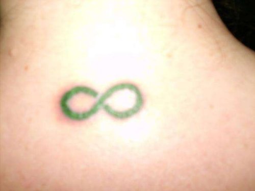 Green Ink Infinity Tattoo On Upperback